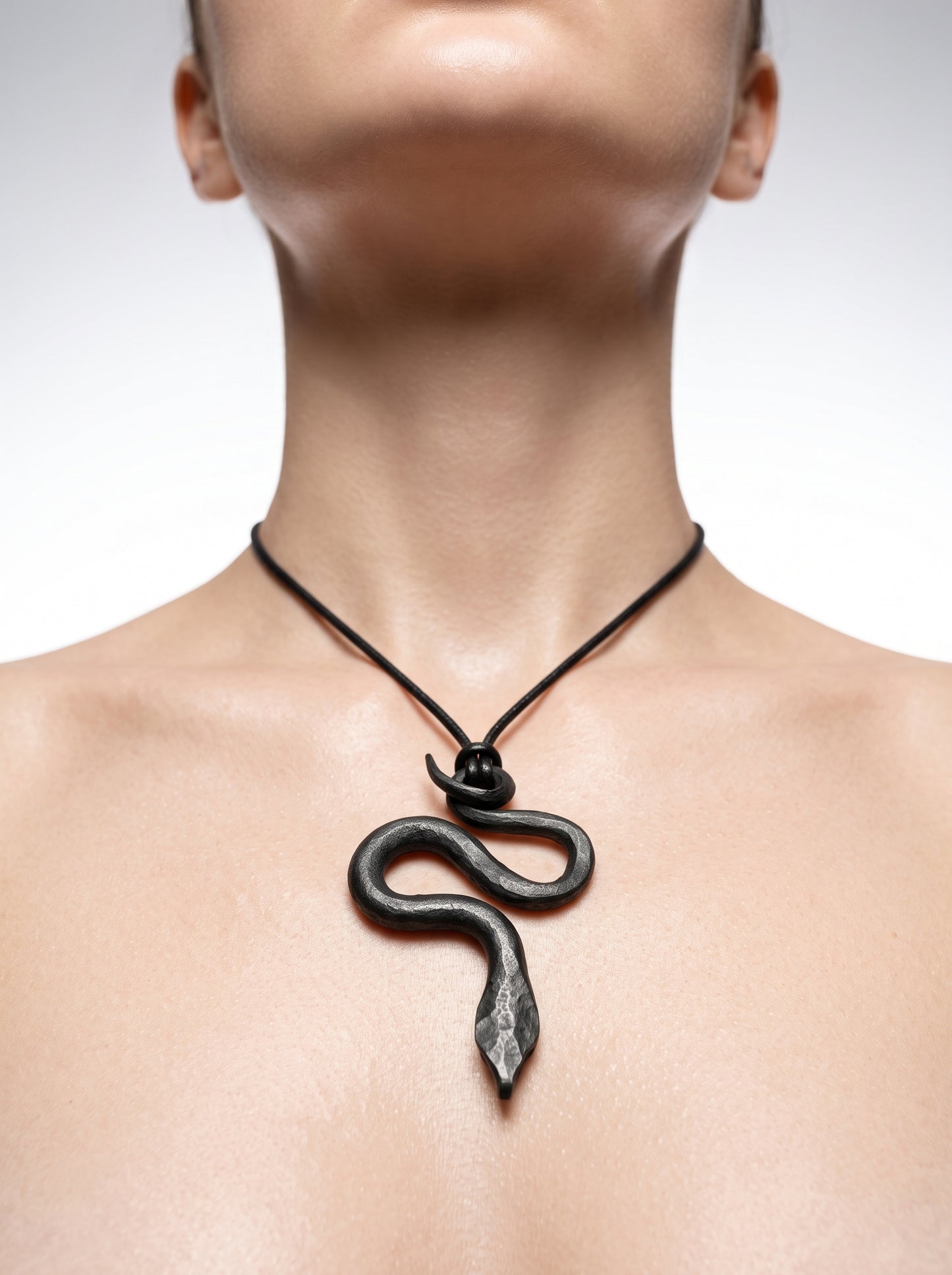 he Obsidian Serpent Sculpted Clay Pendant