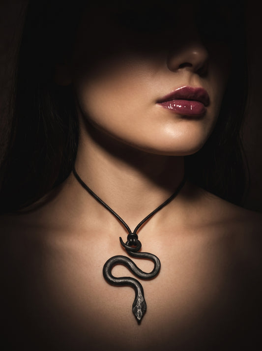 he Obsidian Serpent Sculpted Clay Pendant