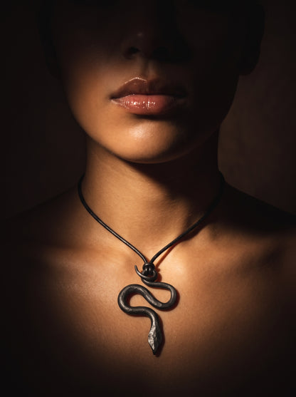 he Obsidian Serpent Sculpted Clay Pendant